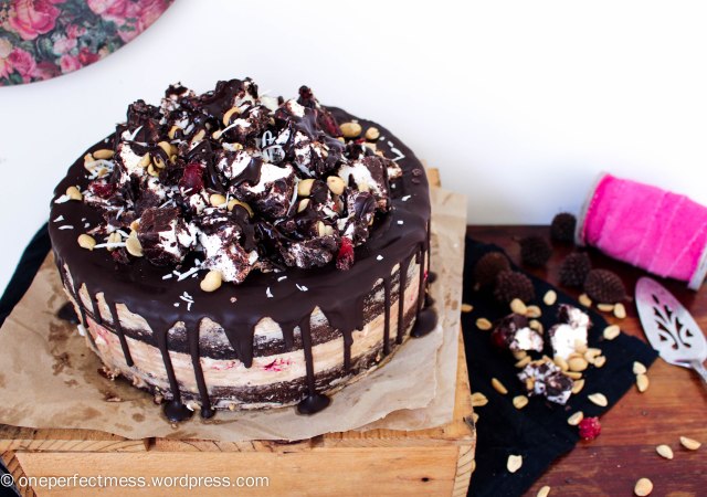 Rocky Road Celebration Cake with Peanut Frosting Swiss Meringue Buttercream Layer Chocolate Cake Peanuts Raspberries Mini Marshmallows Coconut One Perfect Mess recipe